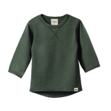 Dark green organic merino long sleeve tee with crew neck, scooped hem, and detail stitching.